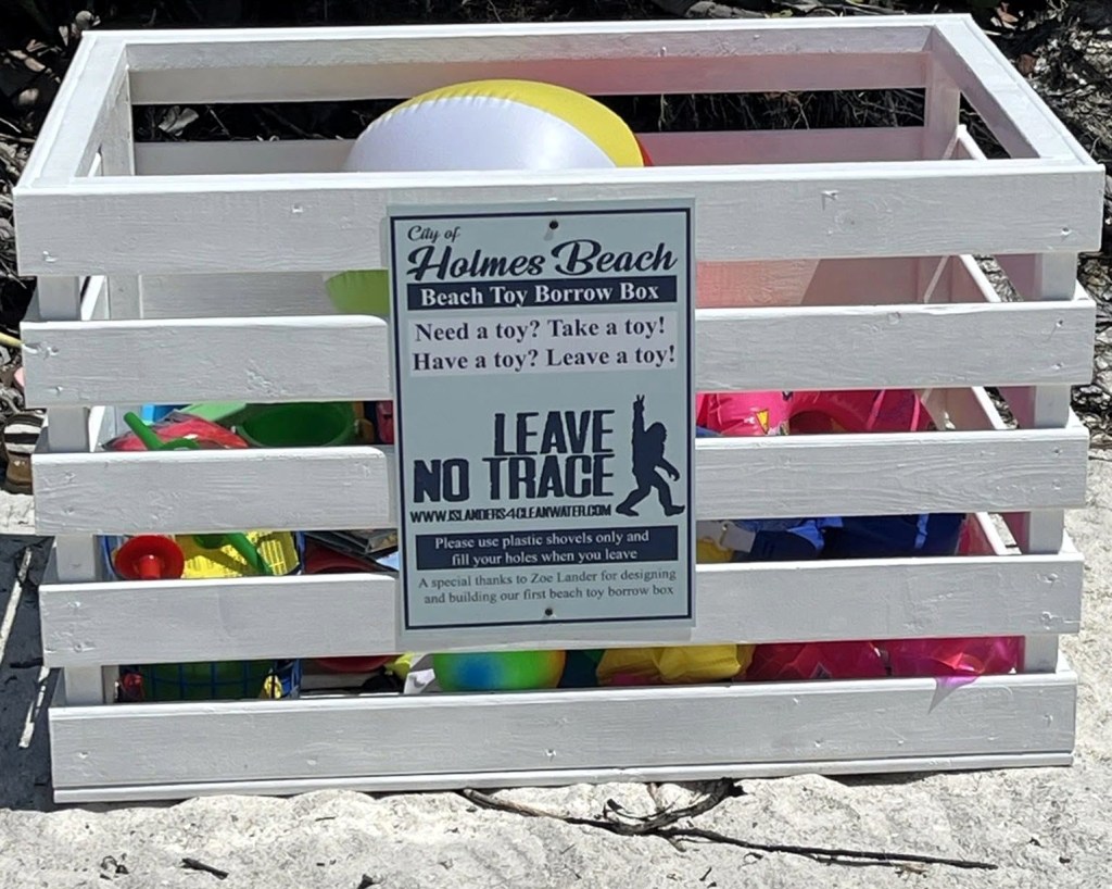 The beach toy borrow bin at Holmes Beach, constructed by Girl Scout Gold Awardee Zoe Lander for her project to reduce beach pollution and save sea turtles.