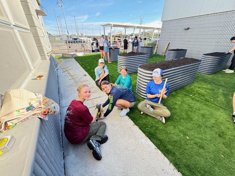 Corrin Zurbrigg of Girl Scouts of Gulfcoast Florida completed her Girl Scout Gold Award project by leading volunteers to build an accessible garden at Barron Collier High School that provides hands-on learning opportunities for students in the Exceptional Student Education program.